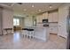 Spacious kitchen featuring a large island with seating, stainless steel appliances, and white cabinets at 4326 Silo Port Ct, Lakewood Ranch, FL 34211