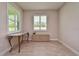 Bright and airy home office space featuring plantation shutters and tile flooring at 4326 Silo Port Ct, Lakewood Ranch, FL 34211