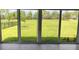 Large patio featuring tile floors, sliding glass doors, and a beautiful view of the backyard at 4326 Silo Port Ct, Lakewood Ranch, FL 34211