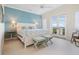 Coastal-themed bedroom with water view, French doors, and ensuite bathroom at 560 Harbor Point Rd, Longboat Key, FL 34228