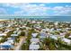 Aerial view of the home showing proximity to the ocean, the pool, and surrounding neighborhood at 727 Holly Rd, Anna Maria, FL 34216