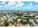 Aerial view of home's prime location close to ocean, surrounded by a lush neighborhood at 727 Holly Rd, Anna Maria, FL 34216
