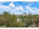 Picturesque aerial view of neighborhood with dense trees and waterway views at 727 Holly Rd, Anna Maria, FL 34216