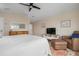Relaxing bedroom featuring a bed, sitting area, and a dresser for clothing storage at 727 Holly Rd, Anna Maria, FL 34216