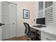 Home office featuring built in desk with storage, a neutral color palette, and a picture window at 727 Holly Rd, Anna Maria, FL 34216