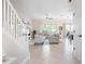 Bright living room, with stylish furnishings, and access to a screened lanai with great views at 727 Holly Rd, Anna Maria, FL 34216
