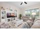 Bright living room, with stylish furnishings, and entertainment center at 727 Holly Rd, Anna Maria, FL 34216