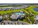 Aerial view of resort-style community pool, clubhouse, golf course and lake at 16127 Fortezza Dr, Bradenton, FL 34211