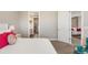 Relaxing bedroom featuring a view of the ensuite bathroom and living room at 16127 Fortezza Dr, Bradenton, FL 34211