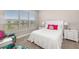 Cozy bedroom with plush carpeting, pond views, and ample natural light at 16127 Fortezza Dr, Bradenton, FL 34211