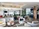 Spacious clubhouse lounge with comfortable seating, decorative lighting and large windows at 16127 Fortezza Dr, Bradenton, FL 34211