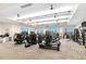 A fitness center with ample gym equipment, fans, and large windows for natural light at 16127 Fortezza Dr, Bradenton, FL 34211
