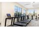 Well-equipped fitness center featuring treadmills, weights, and large windows offering scenic views at 16127 Fortezza Dr, Bradenton, FL 34211
