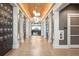 Grand hallway featuring barrel ceiling, wood floors, and elegant lighting fixtures at 16127 Fortezza Dr, Bradenton, FL 34211