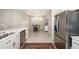 Kitchen view overlooking dining table and stainless steel fridge at 16127 Fortezza Dr, Bradenton, FL 34211
