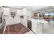 Bright kitchen featuring white cabinets, stainless steel appliances, and a center island at 16127 Fortezza Dr, Bradenton, FL 34211