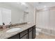 Bathroom with granite countertops, vanity, shower, and tiled flooring at 5726 Aaron Ct, Sarasota, FL 34232