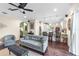 Open-concept living room flows into a modern kitchen with a breakfast bar and wood floors at 5726 Aaron Ct, Sarasota, FL 34232