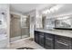 Well-appointed bathroom featuring a glass shower, double vanity, and a separate tub at 5726 Aaron Ct, Sarasota, FL 34232