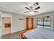 Bright bedroom featuring wood wardrobe and sliding glass doors to the pool at 16834 Toledo Blade Blvd, Port Charlotte, FL 33954