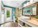 Stylish bathroom with a walk-in shower, modern fixtures, and a serene color scheme with access to backyard at 213 84Th St, Holmes Beach, FL 34217