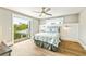 Cozy bedroom with light walls, balcony access and soft natural light at 213 84Th St, Holmes Beach, FL 34217