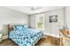 Comfortable bedroom with decorative pillows, starfish quilt, and natural light at 213 84Th St, Holmes Beach, FL 34217