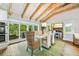 Dining area featuring vaulted ceilings with exposed beams and a charming beach house theme at 213 84Th St, Holmes Beach, FL 34217