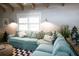 Inviting living room with a comfortable blue sectional sofa and bright natural lighting at 213 84Th St, Holmes Beach, FL 34217