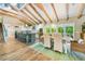 Spacious floorplan with kitchen island and dining area with exposed beams and vaulted ceilings at 213 84Th St, Holmes Beach, FL 34217
