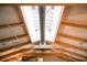 Unique ceiling design with exposed beams and skylights allowing for ample natural light at 213 84Th St, Holmes Beach, FL 34217
