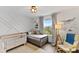 Bedroom featuring natural light, a cozy chair, a crib, and adorable decor at 3409 Anchor Bay Trl, Lakewood Ranch, FL 34211