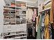 Walk-in closet features built-in shelving and organized storage for clothes, shoes, and accessories at 3409 Anchor Bay Trl, Lakewood Ranch, FL 34211