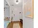 Inviting entryway with wood floors, stylish decor, and a modern front door at 3409 Anchor Bay Trl, Lakewood Ranch, FL 34211