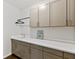 Laundry room has light cabinetry, countertop and a hanger at 3409 Anchor Bay Trl, Lakewood Ranch, FL 34211
