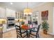 Cozy breakfast nook features a round table with seating and sliding doors to an outdoor patio at 3904 Waypoint Ave, Osprey, FL 34229