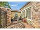 Charming courtyard with a stone fountain, brick pavers, and a lush, green garden at 3904 Waypoint Ave, Osprey, FL 34229