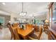 Formal dining room showcasing elegant decor, hardwood table, and open layout to the living areas at 3904 Waypoint Ave, Osprey, FL 34229
