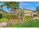 Beautiful single-Gathering home boasting lush landscaping, mature trees, and a private entrance at 3904 Waypoint Ave, Osprey, FL 34229