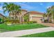 Charming single-Gathering home featuring a well-maintained lawn, lovely landscaping, and a two-car garage at 3904 Waypoint Ave, Osprey, FL 34229