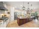 Spacious kitchen with a large center island, stainless steel appliances, and custom cabinetry at 3904 Waypoint Ave, Osprey, FL 34229