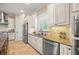 A kitchen space with granite countertops, stainless steel appliances, and custom white cabinets at 3904 Waypoint Ave, Osprey, FL 34229
