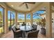 View of the brick paver patio featuring an outdoor table and seating with views of the pool and landscaping at 3904 Waypoint Ave, Osprey, FL 34229