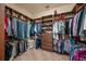 Large walk-in closet with custom shelving and ample storage space for clothes and accessories at 3904 Waypoint Ave, Osprey, FL 34229