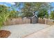 A beautiful fenced backyard has a one-car garage and an ample parking space with gravel at 4536 1St N Ave, St Petersburg, FL 33713