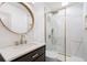 Updated bathroom with a glass-enclosed shower, gold accents, and modern fixtures at 4536 1St N Ave, St Petersburg, FL 33713