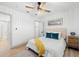 Bright bedroom features neutral walls, wood-look flooring, and a modern ceiling fan at 4536 1St N Ave, St Petersburg, FL 33713