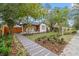 Charming white craftsman home featuring professional landscaping, quaint front porch, and inviting walkway at 4536 1St N Ave, St Petersburg, FL 33713