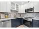 Well-appointed kitchen with marble counters, stainless appliances and ample cabinet space perfect for cooking at 4536 1St N Ave, St Petersburg, FL 33713