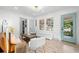 Open-concept living room boasts ample natural light, stylish furnishings, and a seamless flow at 4536 1St N Ave, St Petersburg, FL 33713
